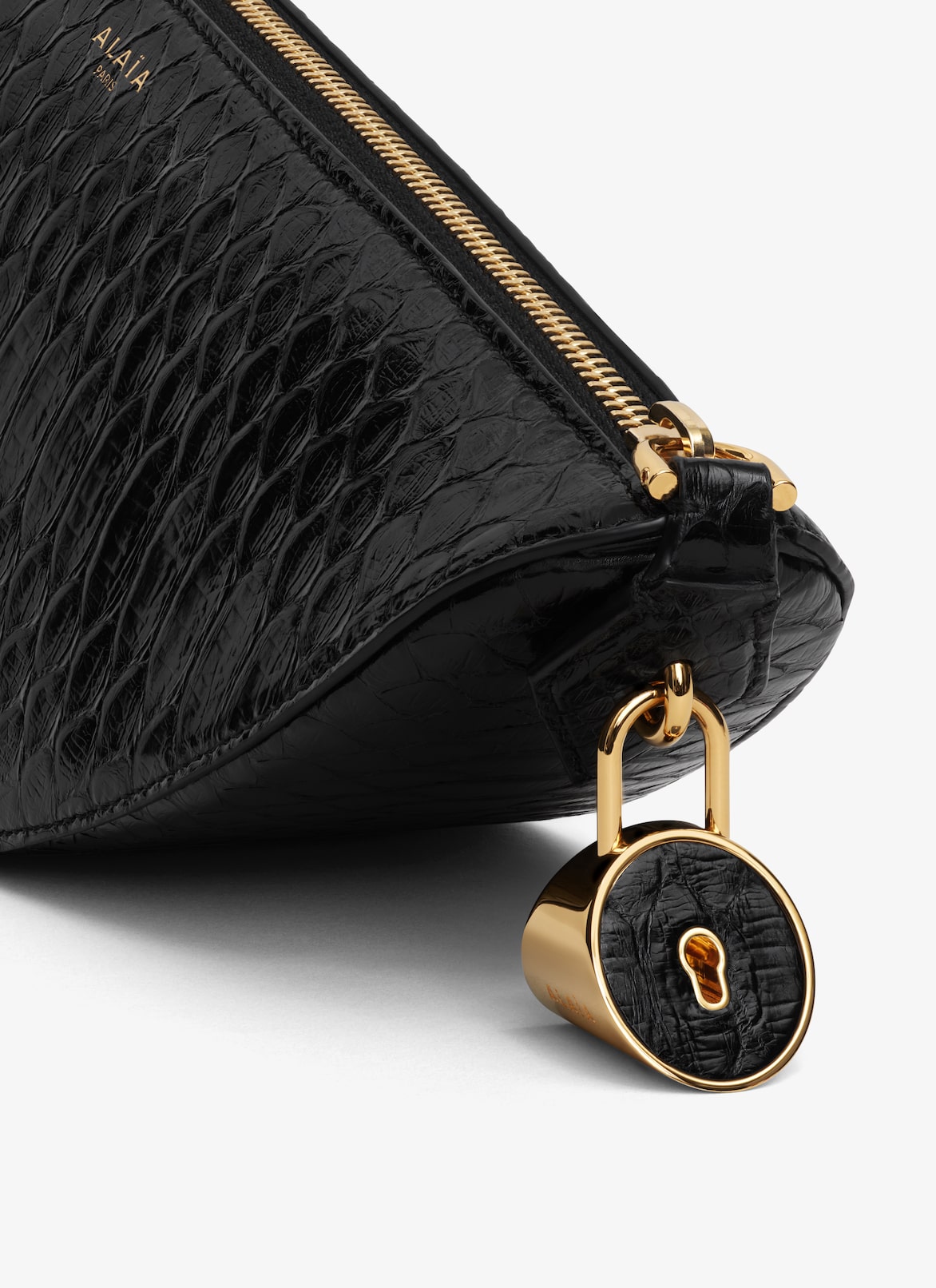 LE DEMI-CŒUR CLUTCH IN PYTHON ALAÏA  LE DEMI-CŒUR CLUTCH IN PYTHON